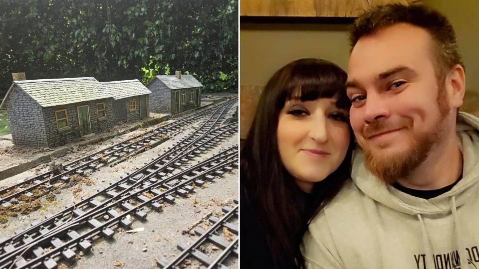 Lauren and Sean Grand with a model train set in the garden